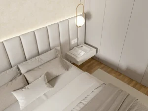 Przykład nowoczesnej sypialni z dużym tapicerowanym zagłówkiem łóżkowym w neutralnym kolorze